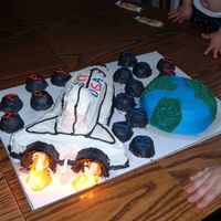 Space Shuttle My first attempt at a 3D cake. Used ice cream cones for the engines and stuck the candles in those. All BC icing. Used a 13 X 9 cake and...