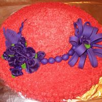 Mom's Red Hat Cake Made this for my mom. Butter cream frosting and Fondant balls and bow. The roses are my first attempt with Gum Paste. Hershey Chocolate...