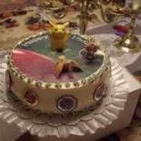 Pokemon A birthday cake for an 8 year old boy who loves Pokemon. Yellow cake with b/c icing. Strawberry filling