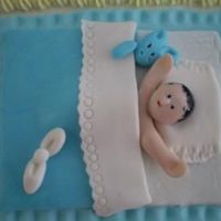 New Born Baby New born baby boy fondant figurine on a cake