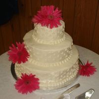 My First Wedding Cake This was my very first wedding cake...boy was it an experience! 6", 10" and 14" WASC with BC icing. Fresh Gerber Daisies
