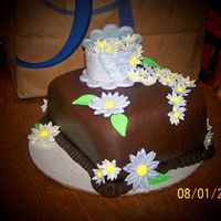 Fondant & Gumpaste Final Cake white cake with blueberries, bavarian cream filling, vanilla bc, covered with choc satin ice fondant (my new favorite food!!).