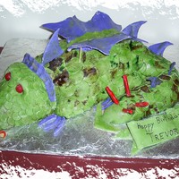 Trevor's Dragon Fondant covered carved cake, purple wings!