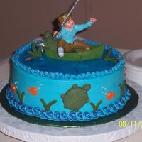 Fishing Grooms Cake white almond cake with raspberry fill. fondant turtles and grass. used piping gel for water