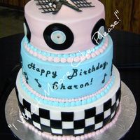 Elvis Lover's B-Day Party This was for my MIL's 65th surprise b-day party. 12" WASC, 10" Chocolate, 8" French Vanilla covered in butter cream...