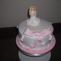 Aoife's First Communion Chocolate Sponge with Chocolate Buttercream covered in Sugarpaste with Sugarpaste Model