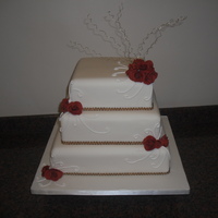 Roses & Swirls 3 Tier Square Ivory Cake with Soft Fondant Roses, Gold Wires and Royal Iced Swirls.
