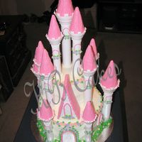 Girl's Castle Cake Castle Cake made from Wilton Castle Kit. Turrets were frosted with pink royal icing. Center cakes were 2-layer 10" and 2-layer 6&quot...