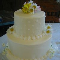 Two Teired Daisy's Two Teired Marshmellow Fondant with Artificial Flowers