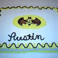Batman Cake This is a 1/2 sheet cake, chocolate fudge with buttercream frosting. The bat is homemade fondant. Thanks for looking.