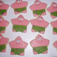 Patrick sugar cookies with antonia74's icing. I added icing eyes and used food writers for the yebrows and smirk. I know he has purple flowers...