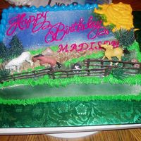 Horse's Yellow cake with fresh strawberry filling,iced in IMBC. Airbrushed the grass,dirt road and sky. Added some buttercream grass and a sun....