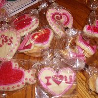 Valentine's Cookies Sugar cookies with Anatonia74's cookie icing. I used a stencil on some. They were also painted with luster dust after the icing set up...