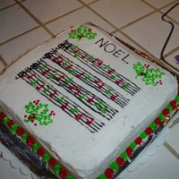 Sheet Music Cake I tried to make this cake look like a sheet music. The notes are in red and green to be festive