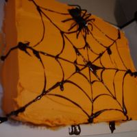Spiderweb Cake This is a quick snapshot of my Halloween cake. It would have been a better picture if I would have taken it once I placed it on the glass...