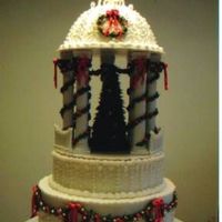 Christmas Gazebo This is a scaled-down version of a Colette Peters design. Wreaths, garlands, bows, top ornament and decorated tree are all royal icing....