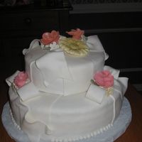 Fondant Cake W/roses & Gerber Daisies Very green at working with fondant & gum paste.