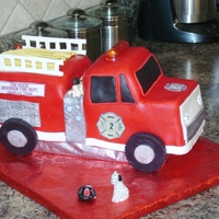 Firetruck Cake This was a white cake with buttercream and fondant icings. The headlights, rear strobes and light bar all lit up!! It was great fun to make...
