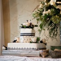 Midnight Blue White cake with champagne fondant icing and midnight blue accents.