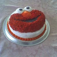 Elmo's 1St Birthday This was a birthday cake for my nephew. I used the wilton character pan on a round cake. The stars didnt look quite right on elmo so used...