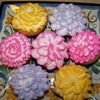 Flower Cookies Sugar cookie dough rolled into balls and placed in mini muffin tin. Made royal icing flowers on each little cookie