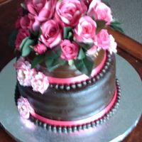 Birthday For A Diva! Chocolate fondant covered cake with chocolate cake and hazelnut buttercream top tier. Vanilla cake with stawberry mousse.