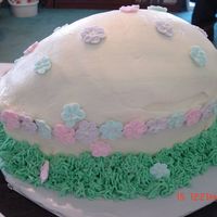 Easter Egg A cake made for a friend for Easter. Cream cheese frosting, royal icing flowers, the grass is cc frosting made with the grass tip.