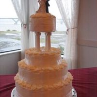 White On White Rose Wedding Cake This is my very first wedding cake. It is buttercream with a white buttercake raspberry and bavarian cream filling.