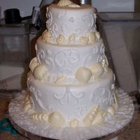 Seashell Cake My first tiered cake and first time doing scrollwork. 4", 6", 10" white chocolate cake with all BC icing. Seashells are...