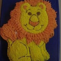 Wilton's New Friendly Lion Pan Isn't this pan cute? I just love it. My son wanted this pan, so we brought it home and made one up. I added a little depth to the mane...