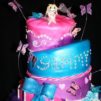 Butterflies And Ballerina my daughters 7th birthday cake. 2 bottom layers are dumies blue tier is a Chocolate butter cake from whimsical bakehouse book (very good )...