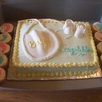 Baby Shower Cake And Cupcakes Made with vanilla cake, buttercream icing and fondant accents.