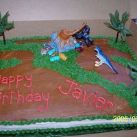 King Kong This was for a 5 year old birthday. This is a 1/2 sheet covered with buttercream. I used candy rocks and plastic trees that came with the...