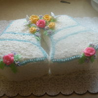 Wedding Bell Bridal Shower Cake Made this for a friend's cousins shower. BC frosting and flowers. Doves are plastic. The white dots on the trim are pearl white sugar...