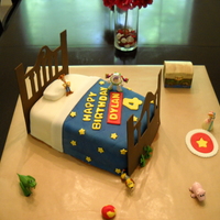 Toy Story Bed Cake This cake i made to look like the bedroom from the Toy Story Movie. Double Chocolate Cake with Oreo Filling, Butter Cream, and covered in...