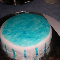 Blue Stripes confetti cake, buttercream covered in mmf. This was an attempt to use wiltons shimmer dust, needless to say i didnt get the effect i wanted...