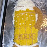 Cheers! a beer mug made from the golf bag pan. chocolate cake with buttercream frosting. Made very quickly - a friend was coming to visit and i...