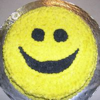 Smile! a 12in round white cake made to cheer up a coworker - not so perfect, but it was very cute and cheerful