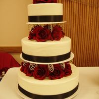 Bridal Fair Cake This was a cake that I did for a bridal fair. 14,10,6 inch all done in buttercream, satin ribbon and artificial flowers. TFL!