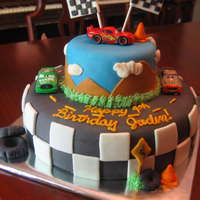 Cars "cars" themed cake. marshmallow fondant over buttercream. All fondant accents except for the 3 cars