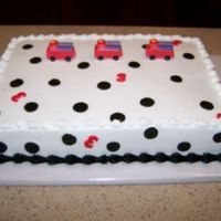 Firetrucks On Dalmation Spots Buttercream frosted 9 X 13. Fondant 3's and mini firetrucks.