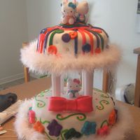 Hello Kitty Cake Made a two tier for daughters 2nd birthday. My second cake. Two tiers, each with 3 layers of cake. Fondant covered, fondant bow, stripes...
