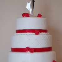 Wedding Cake 3- tier wedding cake. Buttercake with vanilla buttercream and fondant, Each tier is 4-5 inches. 12-10-8 inches. Middle tier has quilting...