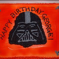 Darth Vader Cake This was done in white buttercream and sprayed red and orange for a "firey" look. The head was actually a seperate cake on top of...