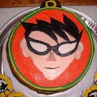 Teen Titans Robin Cake This was for my son's 5th birthday. I made Robin's face out of flesh-tone,black and white fondant. I also made cupcakes to look...