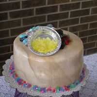 Rock Cake (Geology) Third cake in my series of 5 retirement cakes. Covered in brown marbled MMF and trimmed with rock candy. Topped with several kinds of rock...