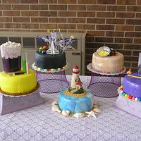 Mom's Retirement Cakes Here is the finished product of my mom's retirement cake. There are a total of 5 cakes, all 2 layer 8 inch rounds, 3 were kalua fudge...