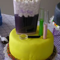 Science Lab Cake First in my series of 5 retirement cakes. Covered in yellow MMF and trimmed with gummy worm candy covered in mini jawbreaker like candies....