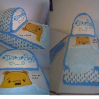 Bassinet Pooh Cake done for my cousins baby showerBig thank to mcassada and the cc boardcake is 11x 13 2 layer, 9.5 round for top, used pin prick method...