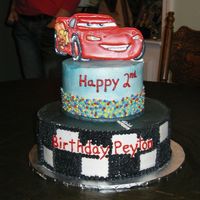 Cars 2 tier cake with color flow McQueen.